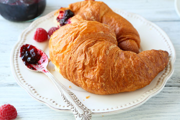Sweet croissant on a plate