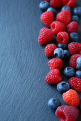 Berry mix on the slate background
