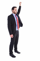 Smiling businessman standing with hand raised
