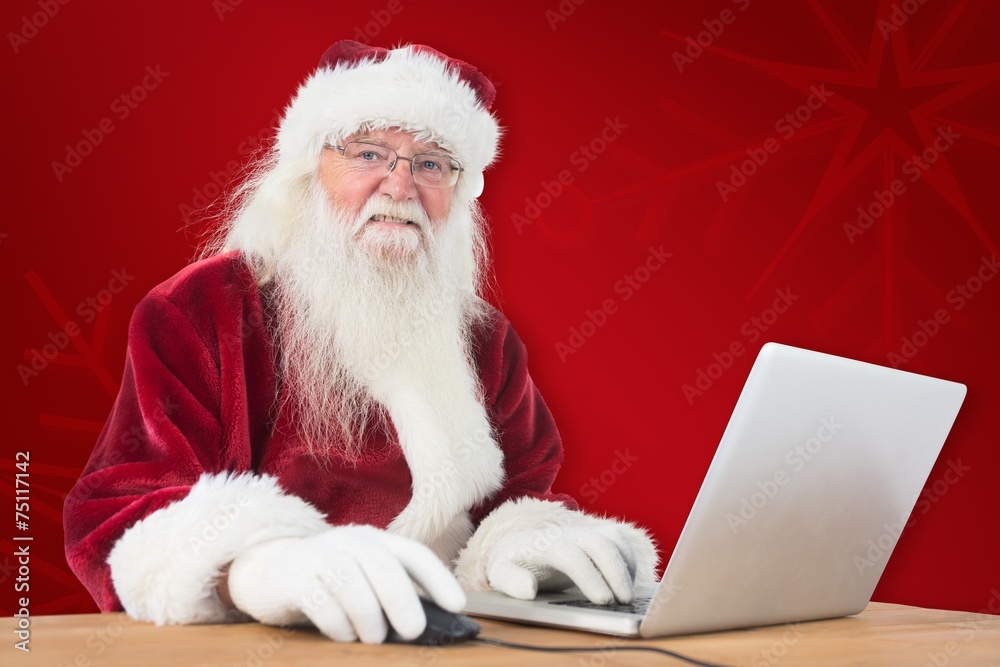 Poster composite image of santa surfs on the internet