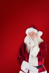Composite image of santa asking for quiet to camera