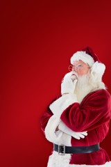 Composite image of santa is thinking about something