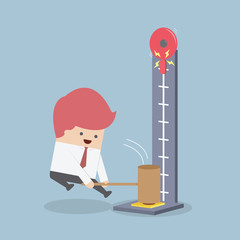 Businessman at a carnival hitting a strength tester with a hamme