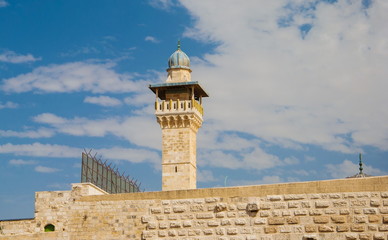 Fototapeta na wymiar minaret and ancient walls of mosque in Jerusalem