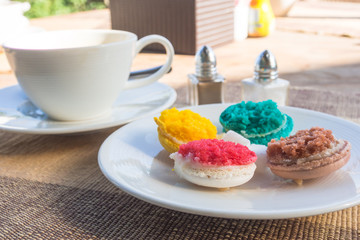 More colorful macarons  on fabric background