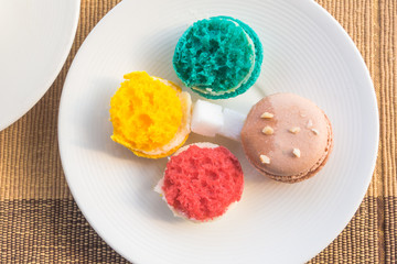 More colorful macarons  on fabric background