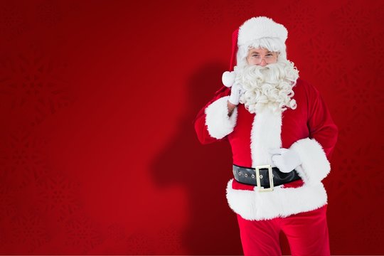 Composite image of smiling santa claus with his sack