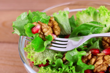 Fresh salad with greens, garnet and spices
