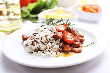 Tasty rice with meat served on table, close-up
