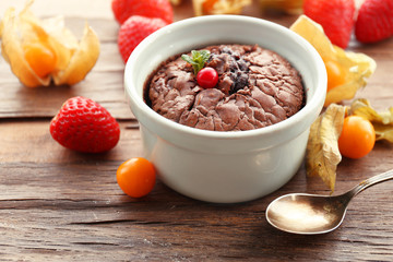 Hot chocolate pudding with fondant centre on table, close-up