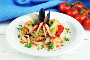 Tasty pasta with shrimps, mussels and tomatoes