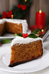 Slice of cake covered cream with Christmas decoration