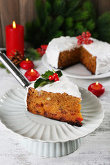 Slice of cake covered cream with Christmas decoration
