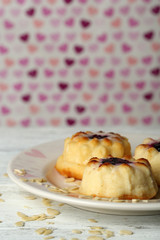 Delicious cheesecake on wooden table, on color background