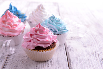 Delicious cupcakes on table close-up