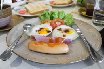 English breakfast with fried eggs, bacon, sausages,