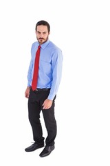 Serious businessman in suit standing