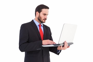 Focused businessman using his laptop