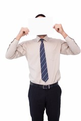 Businessman showing card in front of his head