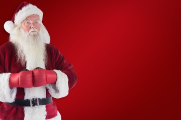 Composite image of santa claus wears boxing gloves