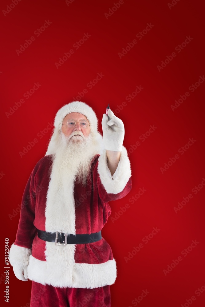 Poster composite image of santa writes something with a pen