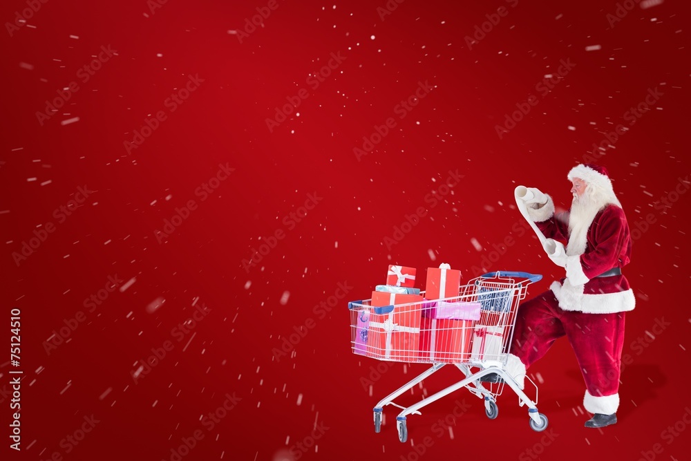 Poster Composite image of santa pushes a shopping cart while reading