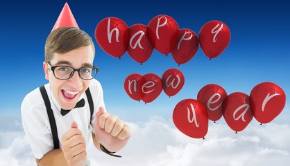 Composite image of geeky hipster in party hat