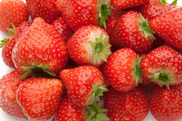 heap of strawberrys on white