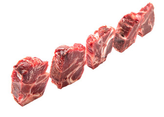 Chunk of cut frozen beef meat over white background 