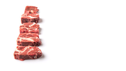 Chunk of cut frozen beef meat over white background 