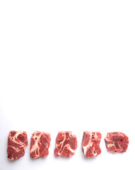 Chunk of cut frozen beef meat over white background 