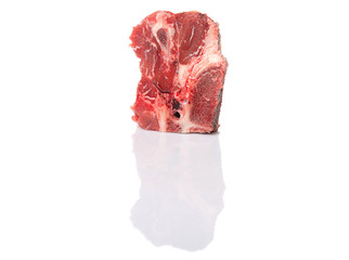 Chunk of cut frozen beef meat over white background 