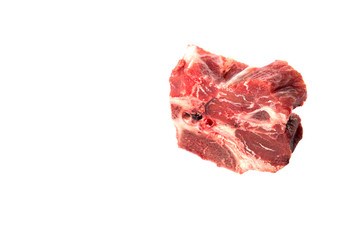 Chunk of cut frozen beef meat over white background 