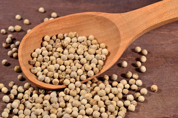 White pepper seeds in a spoon