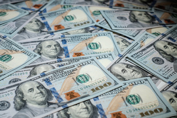 One hundred dollars pile as background