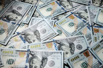 One hundred dollars pile as background