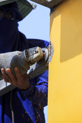 worker hand and electric welding working on industry metal work