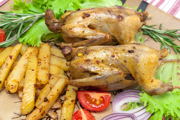 appetizing fried woodcock with potato and fresh vegetables