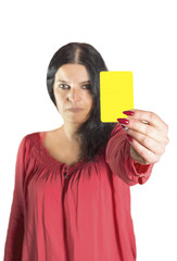 An image of a pretty woman showing yellow card.
