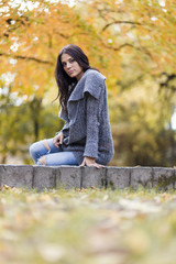 Young woman in the autumn park