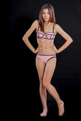 Chinese woman in underwear on black background