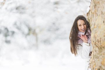 Fototapeta na wymiar Young woman at winter