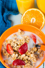 Muesli with fruits and fresh orange juice in jar