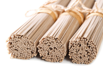 soba noodles in bunches macro isolated horizontal