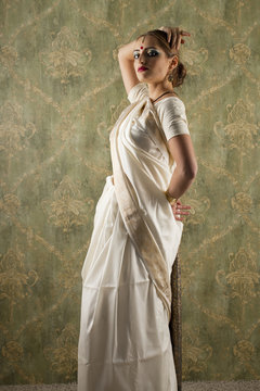 Young pretty woman in indian white dress