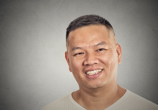 headshot portrait of middle aged man happy smiling
