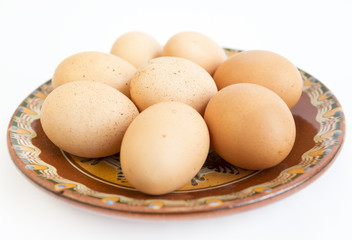 Eggs in painted ceramic plate