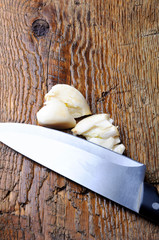 garlic cloves on wooden background