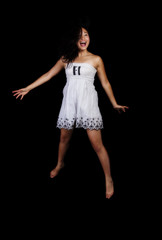 Fototapeta premium Young Attractive Japanese Woman Jumping In Dress