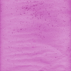 Pink wrinkled paper with ink drops
